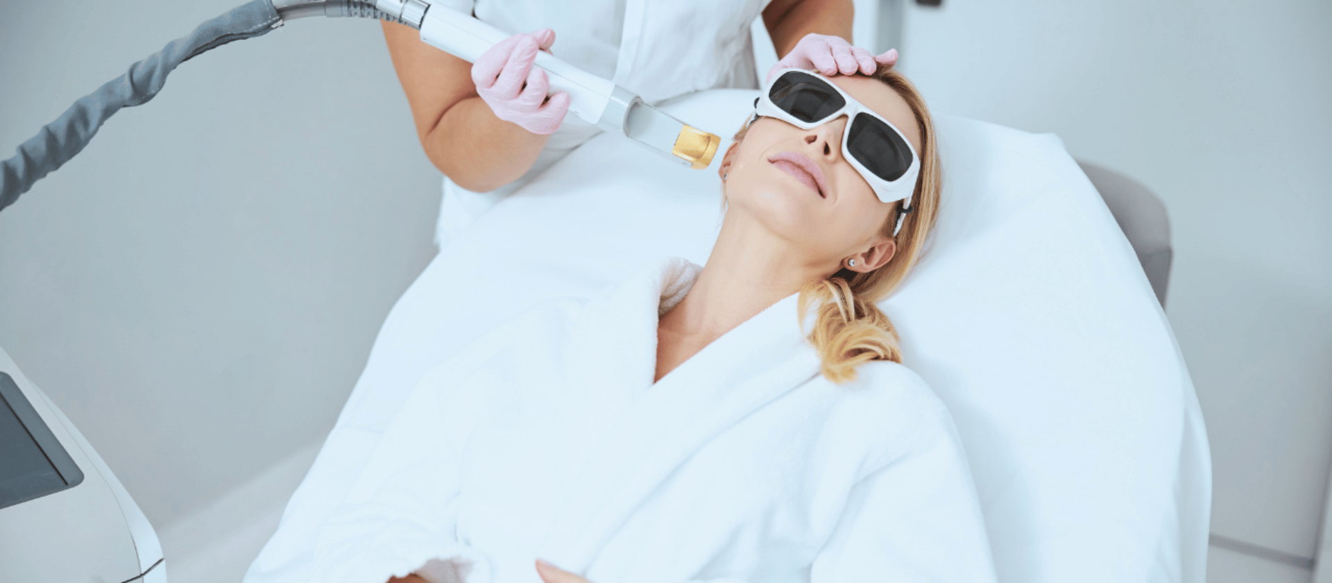 woman receiving laser treatment in dermatology office