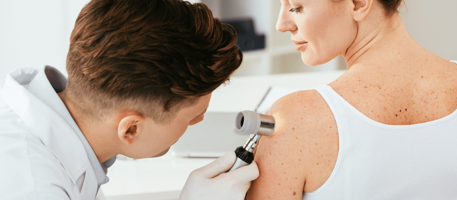 checking out skin growth's on someone's back