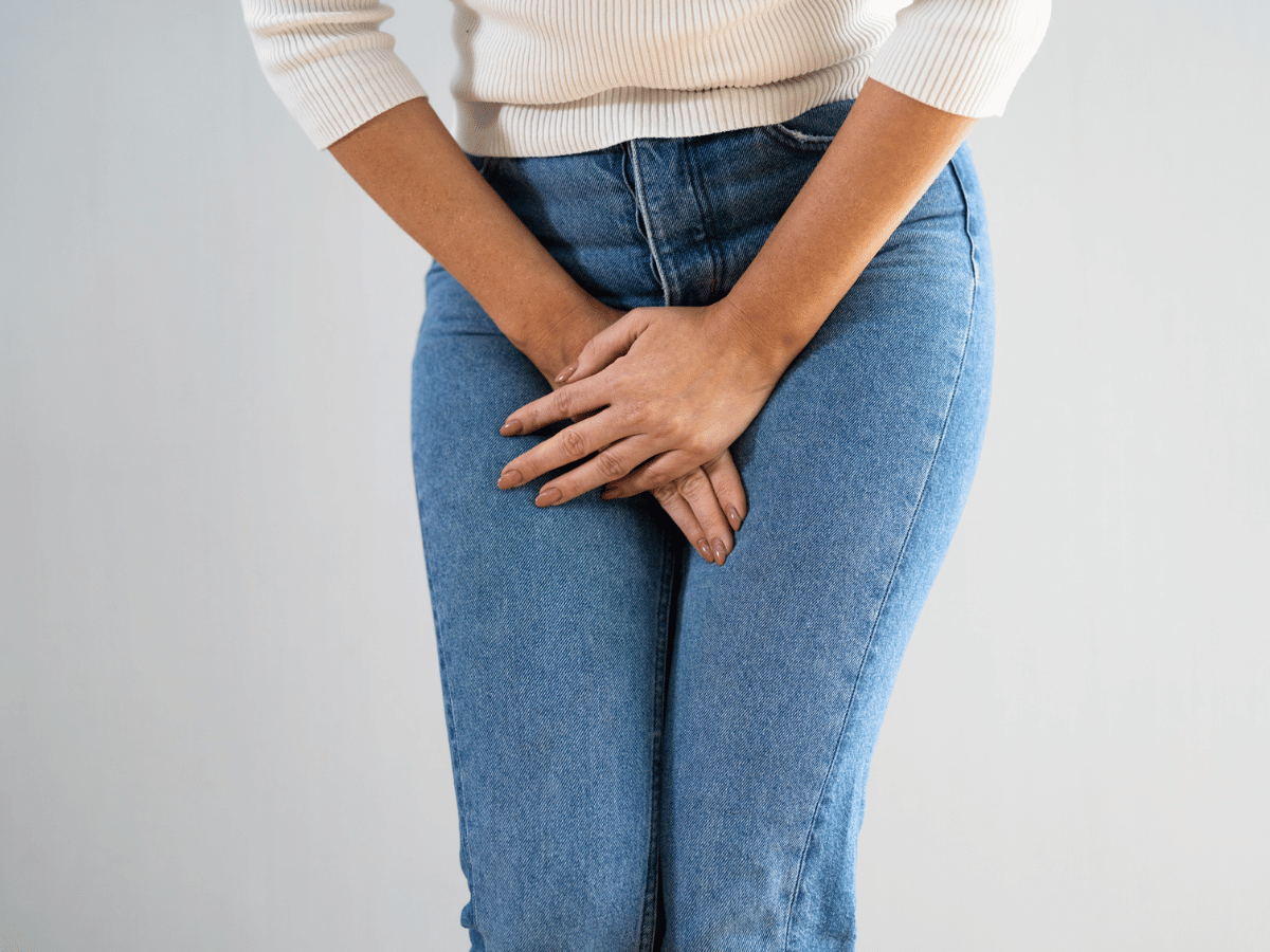 a girl holding her bladder